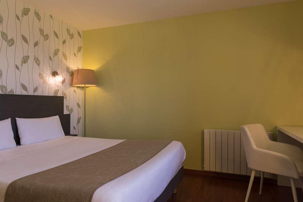 Logis Aux Maisons Habitación foto